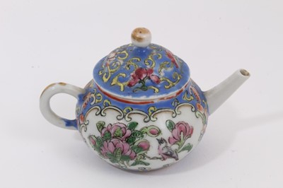 Lot 45 - A 19th century Chinese blue and white porcelain vase and cover, decorated with figural scenes, 23cm high, together with a miniature 19th century Chinese famille rose teapot, 7.5cm high