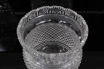 Lot 67 - A large 19th century cut glass covered vase/bonbonniere, diamond and facet cut, the rim with fan-shaped pattern, on knopped stem and circular base, 32cm high