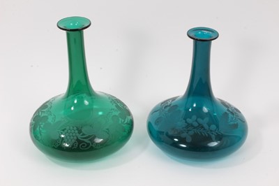 Lot 72 - Two similar 19th century green tinted glass decanters, with etched foliate patterns, 19.5cm and 21cm high (no stoppers)