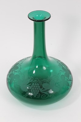 Lot 72 - Two similar 19th century green tinted glass decanters, with etched foliate patterns, 19.5cm and 21cm high (no stoppers)