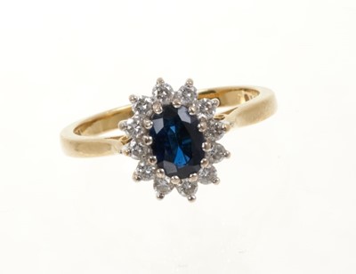 Lot 433 - Sapphire and diamond cluster ring