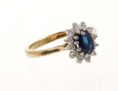 Lot 433 - Sapphire and diamond cluster ring