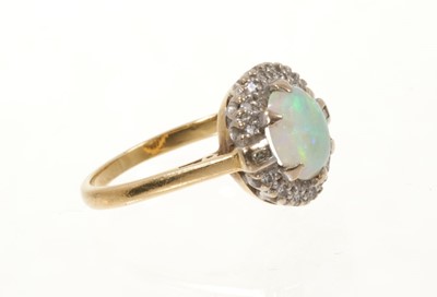 Lot 434 - Opal and diamond cluster ring