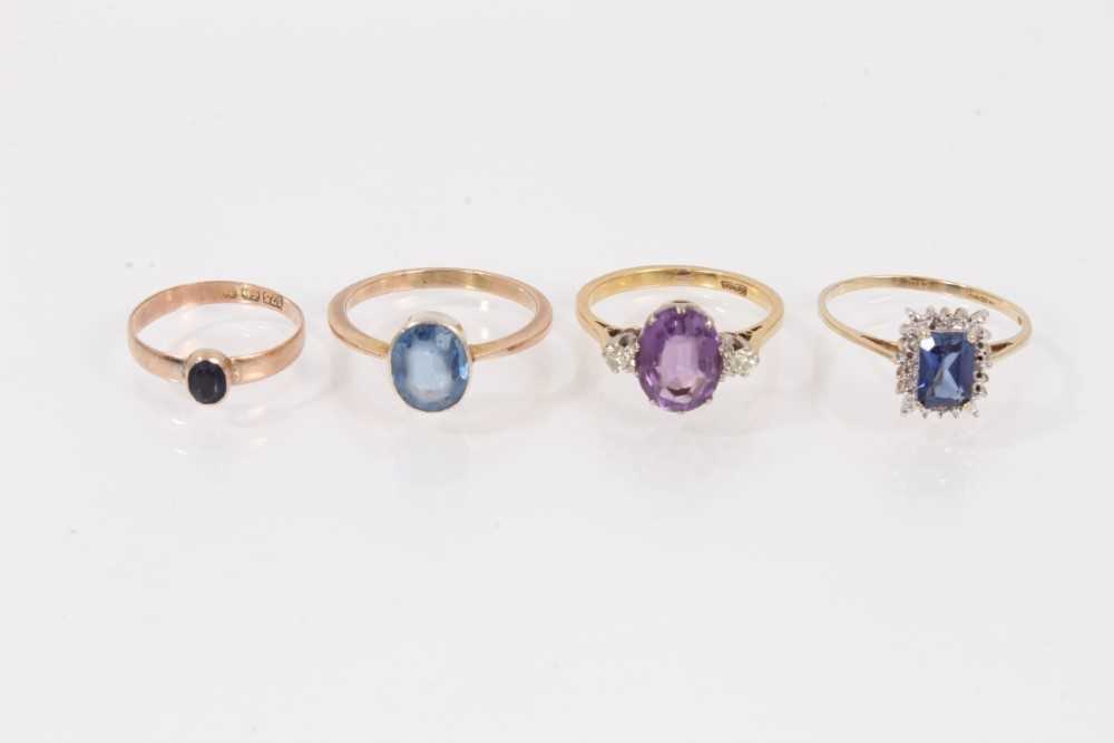 Lot 437 - Four gold and gem-set dress rings