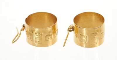 Lot 438 - Pair of 18ct gold earrings