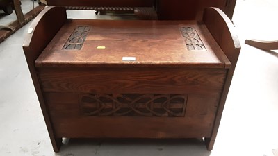 Lot 1106 - Edwardian Arts & Crafts carved oak box stool with hinged seat and iron ring handles