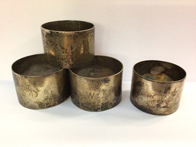 Lot 802 - Three silver napkin rings and one plated (4)