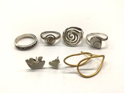 Lot 805 - Pair of yellow metal loop earrings (stamped K18), pair of white metal studs and four silver (925) rings