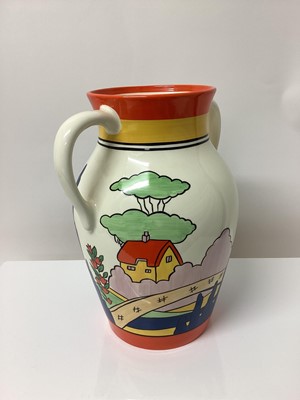 Lot 10 - Wedgwood limited edition two handled Lotus jug decorated in the Orange Roof Cottage pattern, based upon an original by Clarice Cliff, no. 13 of 250, 31cm high, boxed with certificate