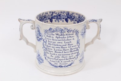 Lot 106 - A large Victorian transfer printed 'God Speed the Plough' loving cup, with vignettes of animals and floral border, 16cm high
