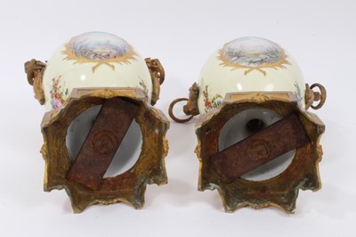 Lot 76 - A pair of 19th century Sevres style ormolu-mounted twin-handled vases, decorated with figural and landscape panels on a floral-decorated pink and pale yellow ground, interlaced L marks to bases, 38...