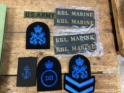 Lot 40 - Military photograph album, cloth badges and cap