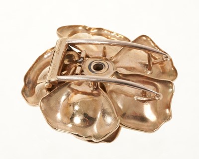 Lot 404 - Cartier gold and diamond flower head brooch