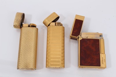 Lot 535 - Two vintage Cartier lighters and a Dupont lighter