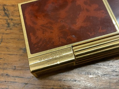 Lot 535 - Two vintage Cartier lighters and a Dupont lighter