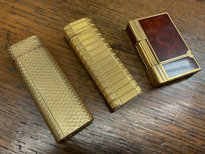 Lot 535 - Two vintage Cartier lighters and a Dupont lighter