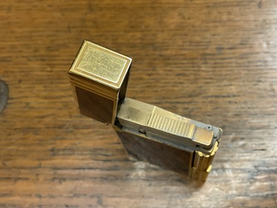 Lot 535 - Two vintage Cartier lighters and a Dupont lighter