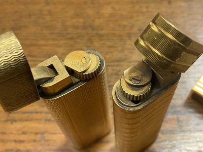 Lot 535 - Two vintage Cartier lighters and a Dupont lighter