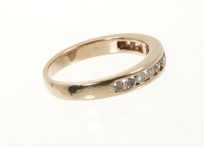 Lot 442 - Diamond eternity ring with brilliant cut diamonds in 14ct yellow gold channel setting