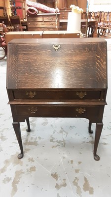 Lot 1015 - Oak bureau with two drawers below on cabriole legs, 76cm wide, 40cm deep, 106cm high