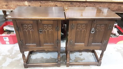 Lot 1020 - Pair of oak two door cabinets on turned and block legs joined by stretchers, 51cm wide, 33cm deep, 68.5cm high