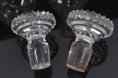 Lot 57 - A pair of 19th century two-ring cut glass decanters with mushroom stoppers, 28cm high
