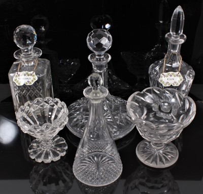 Lot 103 - A group of antique cut glassware, including four decanters of various form (two with Halcyon Days enamel labels), and two footed bowls