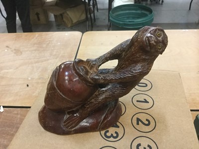 Lot 407 - Decorative carved wooden model of a monkey with glass eyes