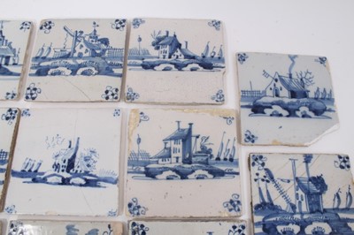 Lot 149 - Collection of fourteen 18th century Delft blue and white tiles, decorated with buildings and Dutch scenes (14)