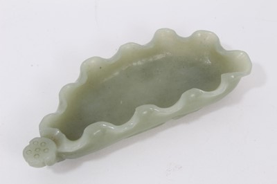 Lot 802 - Chinese carved celadon jade brush washer in the form of a poppy leaf, with relief foliage to underside, 10cm long