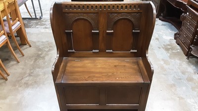 Lot 1027 - Oak Hall bench with arched panelled back and rising lid to seat, 86cm wide, 41cm deep, 105.5cm high