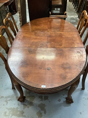 Lot 1030 - Edwardian walnut extending dining table with one extra leaf on cabriole legs with claw and ball feet, opening to 180cm x 105cm, together with a set of four dining chairs