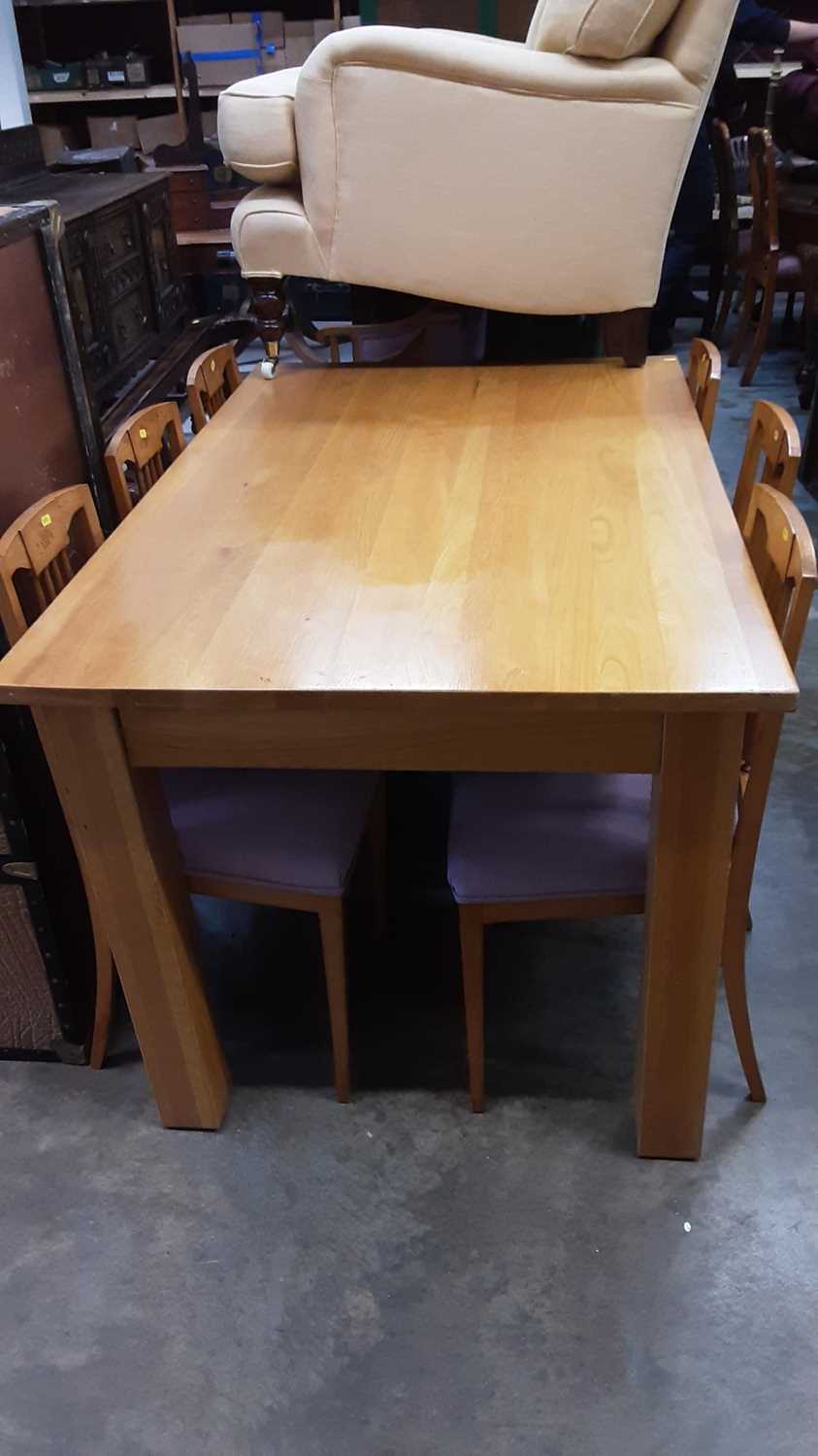 Lot 1036 - Contemporary light oak dining table on square legs, 150cm x 91cm