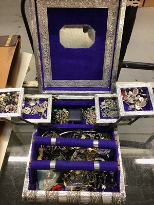 Lot 818 - Silvered Indian jewellery box containing necklaces, bracelets, various earrings and other costume jewellery