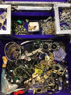 Lot 818 - Silvered Indian jewellery box containing necklaces, bracelets, various earrings and other costume jewellery