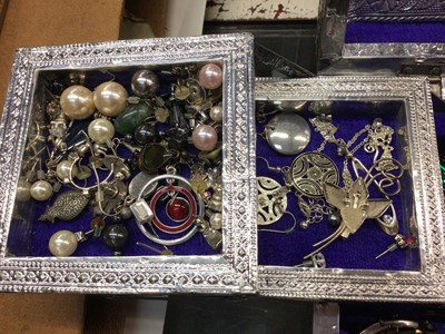Lot 818 - Silvered Indian jewellery box containing necklaces, bracelets, various earrings and other costume jewellery