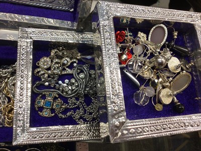 Lot 818 - Silvered Indian jewellery box containing necklaces, bracelets, various earrings and other costume jewellery