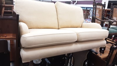 Lot 1038 - Good quality two seater sofa with cream/yellow upholstery on turned front legs with ceramic castors, 154cm wide