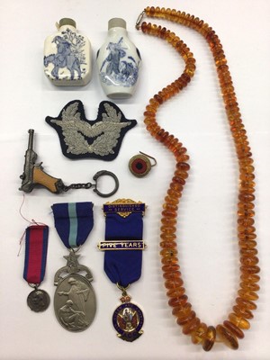 Lot 854 - Baltic amber bead necklace, two Chinese snuff bottles, medals and other items