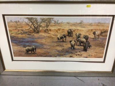 Lot 705 - David Shepherd signed limited edition colour print 'African Waterhole' signed and numbered 157/650, 12" x 27" in glazed gilt frame, together with a book. (2)