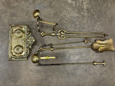 Lot 154 - Brass ink stand, fire dog and fire implements