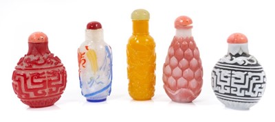 Lot 788 - Collection of five Peking glass snuff bottles and stoppers