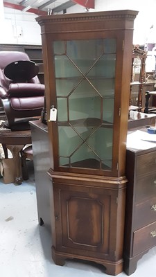 Lot 1042 - Georgian style mahogany corner cabinet with adjustable shelves enclosed by astragal glazed door, with panelled door below