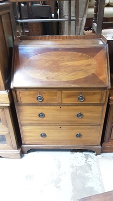 Lot 1054 - Edwardian inlaid mahogany bureau with fitted interior above two short and two long drawers