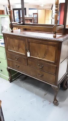 Lot 1044 - Early 20th century mahogany cabinet with ledge back, two panelled doors and three drawers below on carved cabriole legs with claw and ball feet, 121cm wide, 51cm deep, 124.5cm high