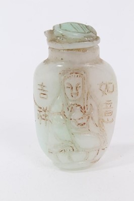 Lot 790 - Chinese russet jade carving of a pike in waves, 20cm high, together with carved jade snuff bottle and stopper and a carving of a fruit. (3)