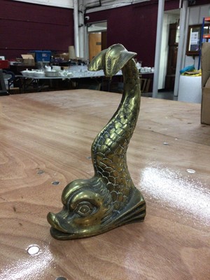 Lot 58 - A heavy brass doorstop in the form of a mythical dolphin, 25.5cm high