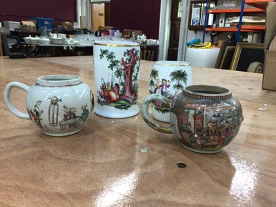 Lot 61 - Two 18th century German milk glass tankards, polychrome painted with figural scenes, together with two 18th century Chinese famille rose teapots (a/f)