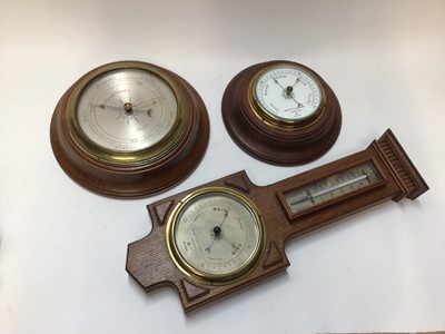 Lot 2430 - Three Negretti & Zambra oak barometers