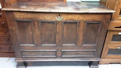 Lot 1056 - Eighteenth century oak coffer with hinged lid and panelled front, raised on square feet, 128cm wide, 55cm deep, 88cm high